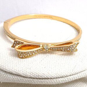 Kate Spade Love Notes Ribbon Bow Rhinestone Gold Tone Hinged Bracelet